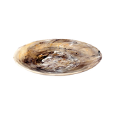 Round agate stone with brown and white patterns on a white background