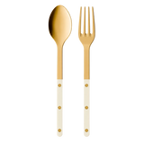 Gold spoon and fork with white handles on a white background