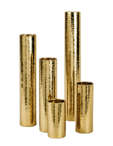 Set of five gold metallic vases of different heights on a white background