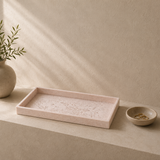 Decorative tray with a vase and small bowl on a neutral background