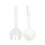Set of two clear plastic salad servers on a white background