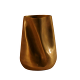 Gold vase on a brown background