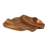 Wooden bowl with wavy design on a white background