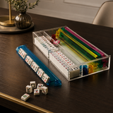 Mahjong set with tiles and dice on a wooden table