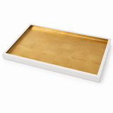 A rectangular white tray with a textured gold interior, photographed at an angle on a clean white background.